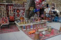 Street of the old city with traditional Azerbaijani carpets on the wall and the seller