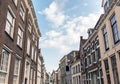 Street with old houses under blue cloudy sky. Deventer, Overijssel, Netherlands.
