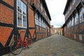 Street with old houses and vintage bicycle, royal town Ribe, Denmark