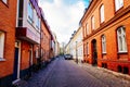 Street with old nice colorful houses in historical center of Malmo