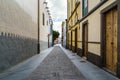 street with old, picturesque and charming houses in bright colors in the city of Las Palmas de Gran Canaria. Canary Islands. Spain