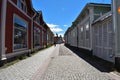 Street of Old Rauma with a cyclist and a van