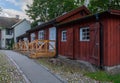 Street with old, red, wooden houses. View with old home.