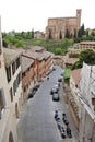Street of old Siena and Basilica of San Domenico, Tuscany, Italy Royalty Free Stock Photo