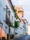 Street in the Old Town of Estremoz, Portugal. Three Crowns tower