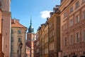 Street in old town with Royal Castle Clock Tower - Warsaw, Poland Royalty Free Stock Photo