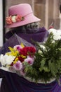 Older woman with flowers to sell Royalty Free Stock Photo