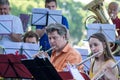 Street orchestra play music at park on Annecy lake. Haute-Savoie, France