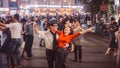 Hanoi, Vietnam - December 3, 2016: Street pair dancing in Hanoi. Vietnamese man and woman dance and rejoice very actively