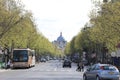 The street in Paris, France - basilica, trees, cars, pedestrians