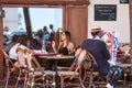 The street Parisian landscape - cafe in Montmartre with an draws artist, Paris Royalty Free Stock Photo