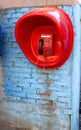 Street payphone telephone set in a red booth Royalty Free Stock Photo