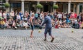 Street performer engages audience outside Covent Garden Royalty Free Stock Photo