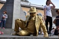 Street performer, living statue in golden costume Royalty Free Stock Photo