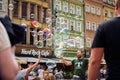 Street performer makes big bubbles on city street to entertain children and tourists. Royalty Free Stock Photo