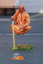 Street performer, man levitating in Rome, Italy