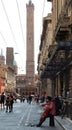 Street performer, playing cello in the historic downtown district of Bologna. Busking on street Royalty Free Stock Photo