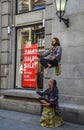 Street performers doing levitating man in center of Oslo Royalty Free Stock Photo