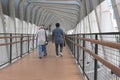 people cross the road via crossing bridge