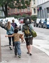 Street photographer with a large format camera over the shoulder..