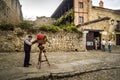 Street Photographer with an Old Plate Camera Held on a Tripod Taking Pictures in Town Square