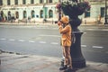 Street photographer, tourist taking photo on Nevsky Prospect in St. Petersburg