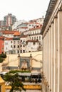 Street photography of Coimbra hilly city center vertical columns of a building - Vertical, Jardim da Manga Cloister, Portugal