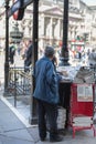 Street Photography: Elderly Newspaper Salesman with a hat in LondonÃ¢â¬â¢s Street