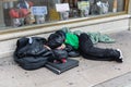 Street Photography: Homeless Sleeping on the Street in front of a Store Window