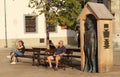 Street photography - people sitting on benches and relaxing