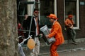 Street portrait of men in orange, crazy look, preparations for King`s Day festivity in the Netherlands