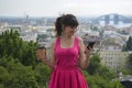 Street portrait of a stylish woman against the background of the architecture of the old town Royalty Free Stock Photo