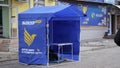 Street promoters tent with campaign media materials advertising candidate for President of Ukraine Alexander Vilkul. Opposition