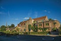 Street with public school brick building at sunset in Tielt. Royalty Free Stock Photo