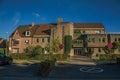 Street with public school brick building at sunset in Tielt. Royalty Free Stock Photo