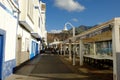 View on the street and the restaurant Terraza El Oliver in Puerto De Las Nieves, Gran Canaria, Spain - 12.02.2017. Royalty Free Stock Photo