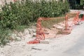 Street reconstruction site with excavation and orange safety net or barrier Royalty Free Stock Photo