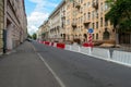 Street repair. white and red plastic barriers restricting car traffic on an asphalt street
