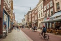 Street with restaurants, shops, cyclist and people strolling in the s-Hertogenbosch downtown. Royalty Free Stock Photo