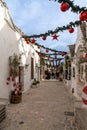 street in the Rione Monti District of Alberobello with Trulli houses and huts and colourful Christmas decorations