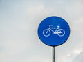 Street or road sign with a bicycle. Bicycle sign with cloudy sky as background Royalty Free Stock Photo