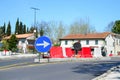 Street with road sign One Way Traffic, plastic safety barrier and temporary yellow markings on sunny day. Construction works Royalty Free Stock Photo