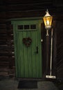 Street of Roros, old wooden green door Royalty Free Stock Photo