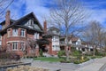 Street with row of large older brick detached houses Royalty Free Stock Photo