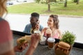 Customers couple ordering hamburgers at food truck