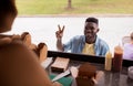 African american man ordering wok at food truck Royalty Free Stock Photo