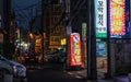 Street Scenario with Shops and traffic during Night of Nam District, Busan, South Korea. Asia