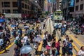 Street Scenario view on a crowded Hongkong Boulevard with Tramway, Pedestrians and Traffic. In Yau Tsim Mong, Hong Kong, China