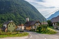 Street Scenario of Village Log pod Mangartom from north direction of predil pass with Julian Alps. Bovec, Slovenia, Europe