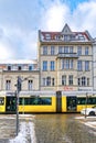 Street scene in Berlin-Koepenick with a streetcar in front of historic buildings